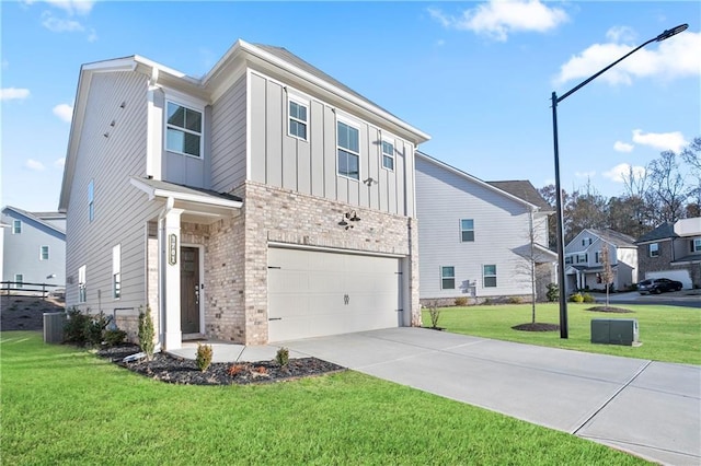 view of front of house with a front yard and a garage