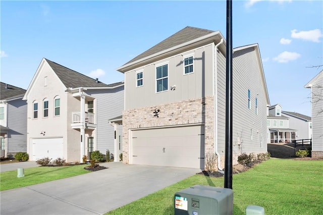 view of front of home with a front yard and a garage