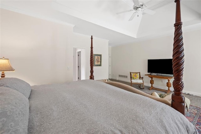 carpeted bedroom featuring ceiling fan, visible vents, vaulted ceiling, baseboards, and ornamental molding