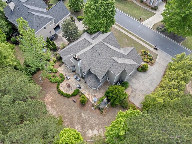 back of house with a patio and a chimney