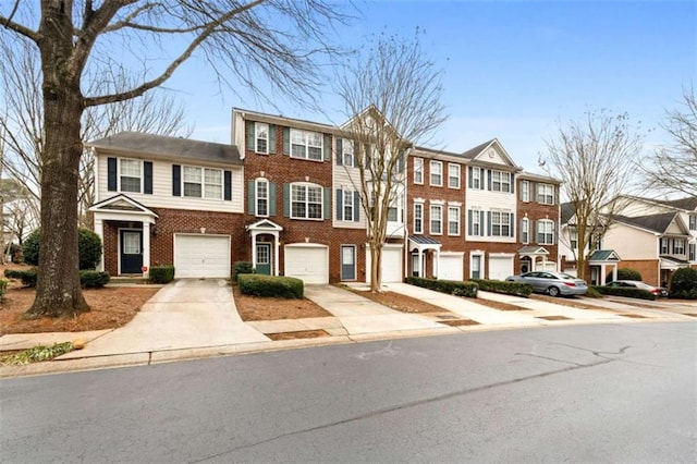 townhome / multi-family property featuring a garage