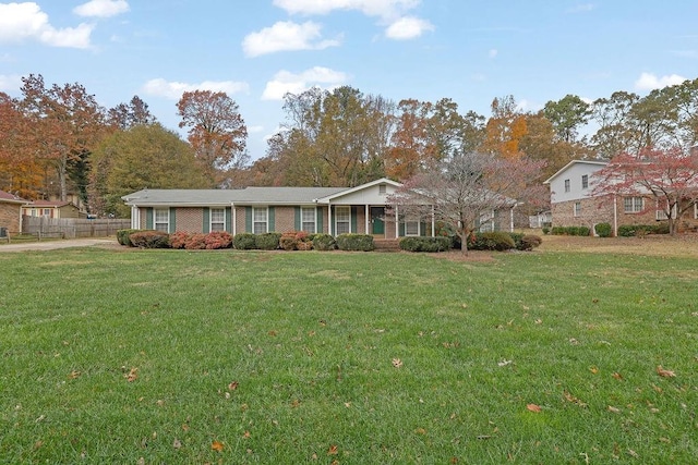 single story home featuring a front lawn