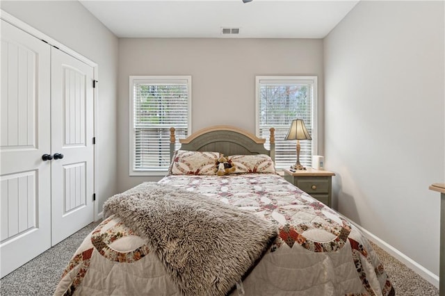 carpeted bedroom with a closet