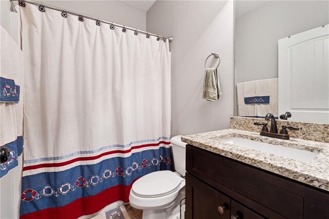 bathroom with vanity and toilet