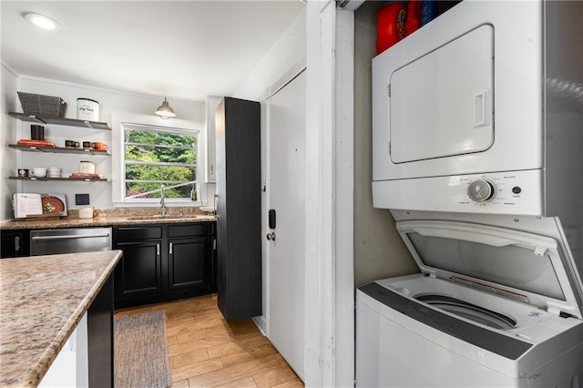 2240 Cheshire Bridge Rd NE Unit 206, Atlanta, GA 30324 - laundry area featuring estacked washer and dryer and light wood finished floors