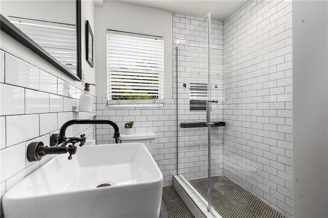 2240 Cheshire Bridge Rd NE Unit 206, Atlanta, GA 30324 - bathroom with a stall shower and tile walls
