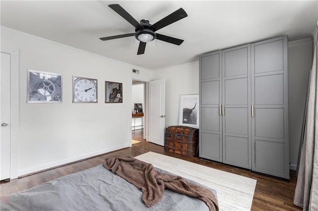 2240 Cheshire Bridge Rd NE Unit 206, Atlanta, GA 30324 - bedroom featuring crown molding, dark wood-type flooring, and ceiling fan