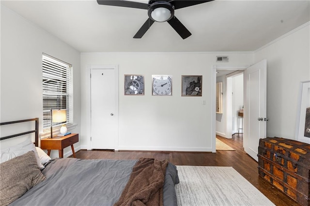 2240 Cheshire Bridge Rd NE Unit 206, Atlanta, GA 30324 - bedroom with dark wood-style flooring, ornamental molding, and ceiling fan