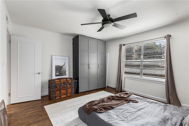 2240 Cheshire Bridge Rd NE Unit 206, Atlanta, GA 30324 - bedroom with dark wood-style floors, ornamental molding, a closet, and ceiling fan