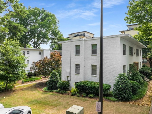 2240 Cheshire Bridge Rd NE Unit 206, Atlanta, GA 30324 - view of property exterior with a lawn