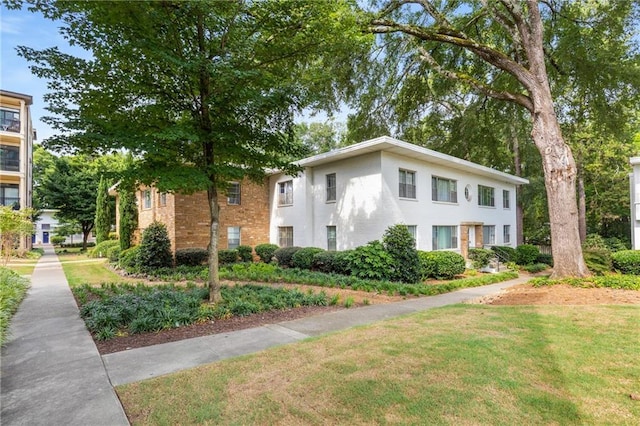 2240 Cheshire Bridge Rd NE Unit 206, Atlanta, GA 30324 - view of front facade with a front lawn