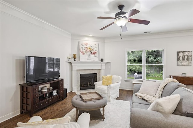 13468 Gardiner Ln, Alpharetta, GA 30004 - living area with crown molding, a tiled fireplace, ceiling fan, baseboards, and wood finished floors
