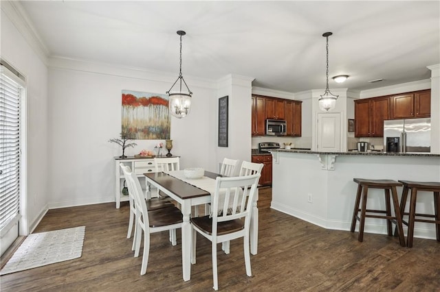 13468 Gardiner Ln, Alpharetta, GA 30004 - dining area featuring dark wood-type flooring, healthy amount of natural light, ornamental molding, and baseboards