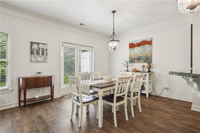 13468 Gardiner Ln, Alpharetta, GA 30004 - dining area featuring dark wood-style flooring, healthy amount of natural light, and ornamental molding