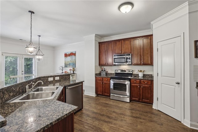 13468 Gardiner Ln, Alpharetta, GA 30004 - kitchen with appliances with stainless steel finishes, a sink, dark wood-style floors, ornamental molding, and pendant lighting