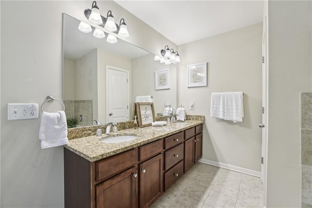 13468 Gardiner Ln, Alpharetta, GA 30004 - full bathroom with double vanity, tile patterned floors, and baseboards