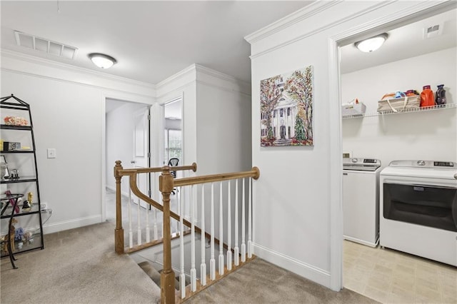 13468 Gardiner Ln, Alpharetta, GA 30004 - hall featuring an upstairs landing, separate washer and dryer, light colored carpet, baseboards, and crown molding