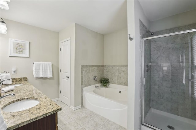 13468 Gardiner Ln, Alpharetta, GA 30004 - bathroom featuring a garden tub, double vanity, a shower stall, baseboards, and tile patterned flooring
