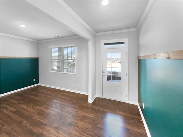 entrance foyer with ornamental molding, a wealth of natural light, and wood finished floors