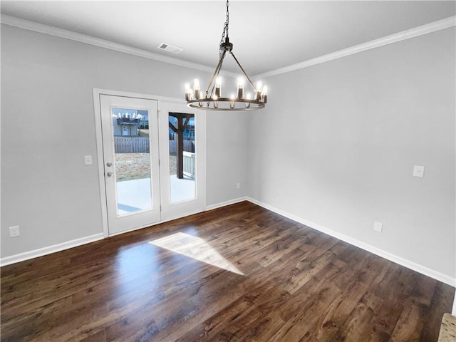 unfurnished dining area with baseboards, visible vents, ornamental molding, dark wood-style flooring, and an inviting chandelier