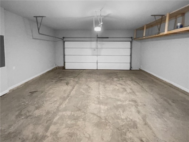 garage featuring electric panel, baseboards, and a garage door opener