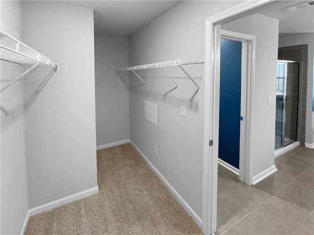 walk in closet with visible vents