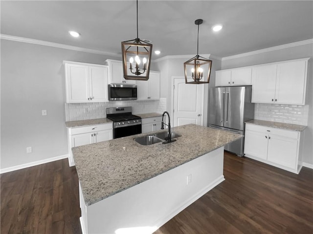 kitchen featuring appliances with stainless steel finishes, light stone countertops, a sink, and dark wood-style floors