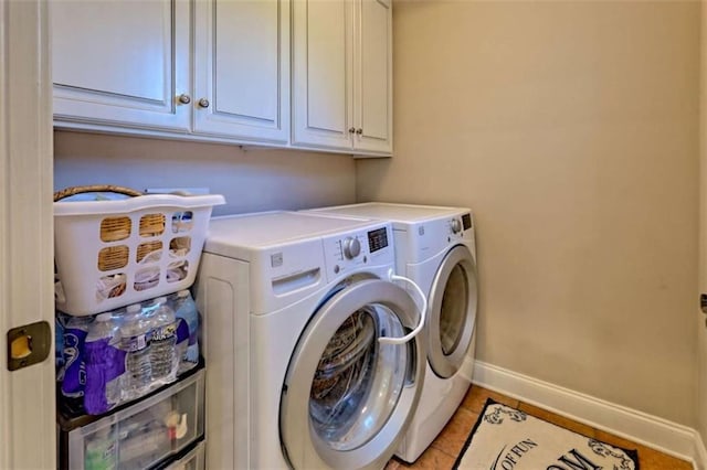 502 Cottage Crest Dr, Clarkesville, GA 30523 - laundry room with washer and clothes dryer, baseboards, cabinet space, and light tile patterned floors