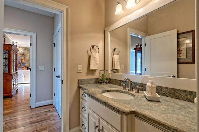 502 Cottage Crest Dr, Clarkesville, GA 30523 - bathroom with vanity, wood finished floors, and baseboards