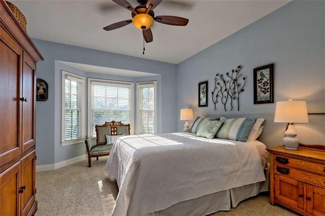 502 Cottage Crest Dr, Clarkesville, GA 30523 - bedroom with light carpet, baseboards, and a ceiling fan