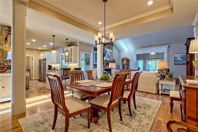502 Cottage Crest Dr, Clarkesville, GA 30523 - dining space featuring light wood-style flooring, recessed lighting, a tray ceiling, and crown molding
