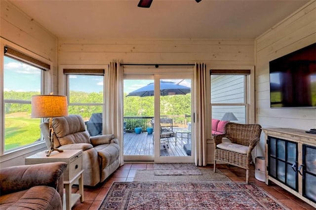 502 Cottage Crest Dr, Clarkesville, GA 30523 - living room featuring wood walls, tile patterned floors, and a ceiling fan