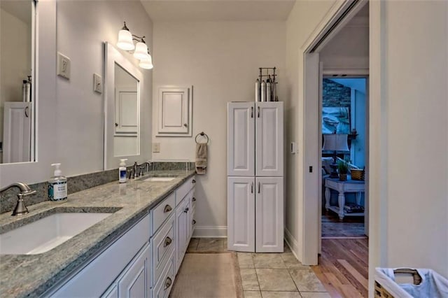 502 Cottage Crest Dr, Clarkesville, GA 30523 - bathroom with double vanity, baseboards, and tile patterned flooring