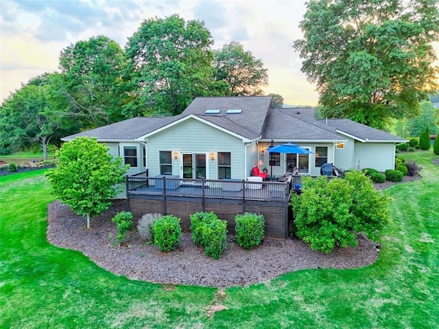 502 Cottage Crest Dr, Clarkesville, GA 30523 - back of property at dusk with a yard and a deck
