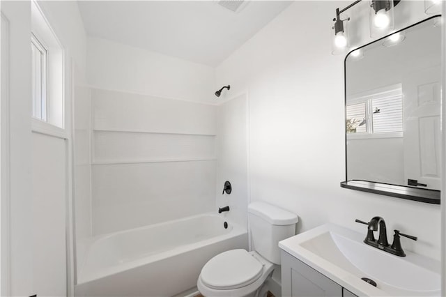 full bathroom featuring vanity,  shower combination, and toilet