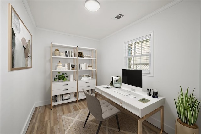 home office featuring hardwood / wood-style floors and crown molding