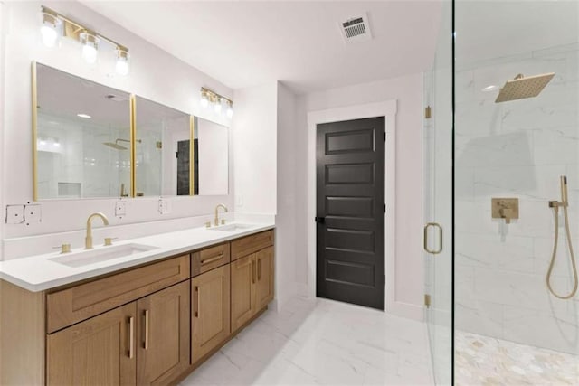 bathroom with marble finish floor, visible vents, a sink, and a marble finish shower