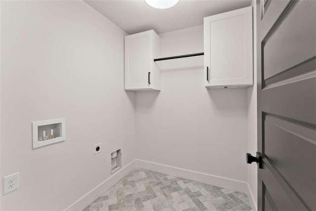 laundry room with cabinet space, hookup for a washing machine, baseboards, and electric dryer hookup