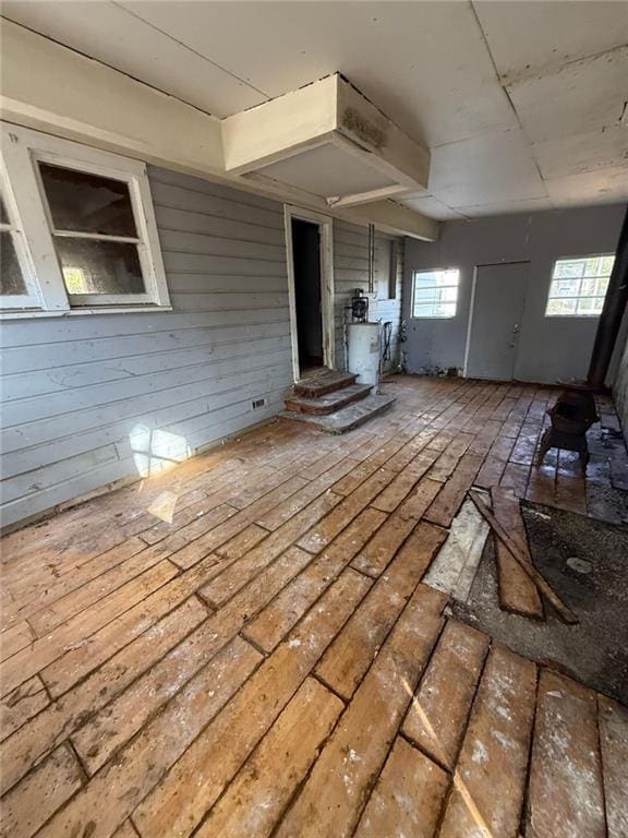 misc room featuring wooden walls