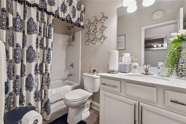 full bath with vanity, shower / tub combo, toilet, and tile patterned flooring