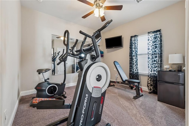 exercise room featuring baseboards and a ceiling fan