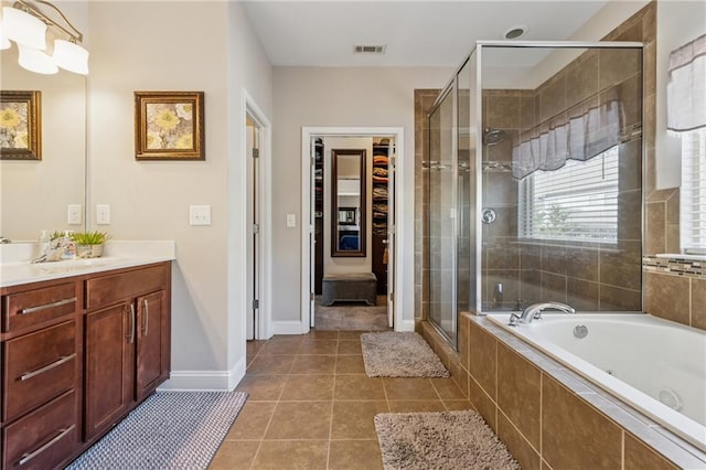 full bath with visible vents, a garden tub, a stall shower, tile patterned flooring, and vanity