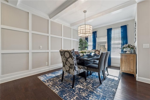 dining space with baseboards, beam ceiling, wood finished floors, and a decorative wall