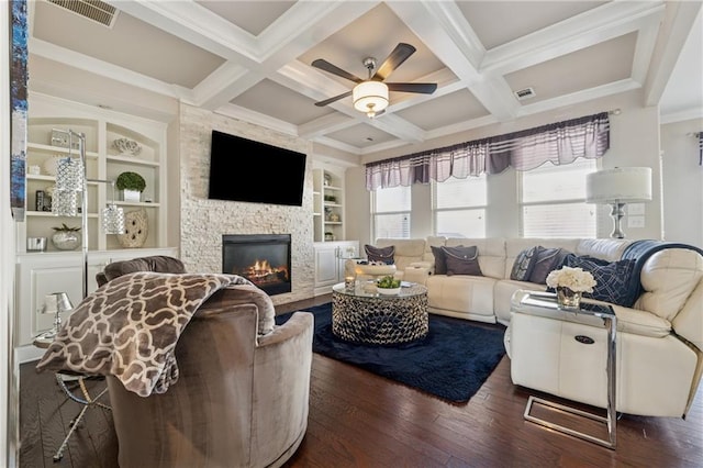 living room with visible vents, beamed ceiling, and hardwood / wood-style flooring