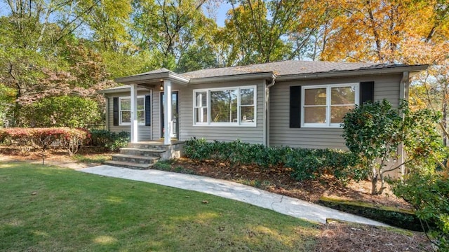 ranch-style house with a front lawn