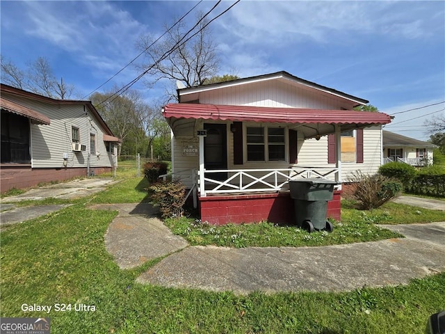 1243 Hill St NW, Conyers, GA 30012 - view of front facade featuring a porch and cooling unit