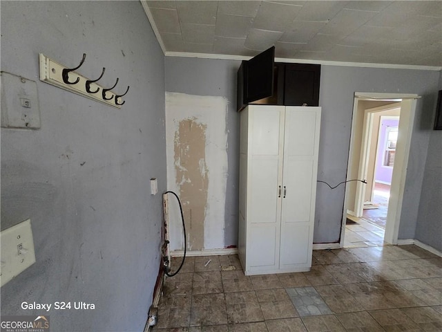 1243 Hill St NW, Conyers, GA 30012 - unfurnished bedroom featuring crown molding and baseboards