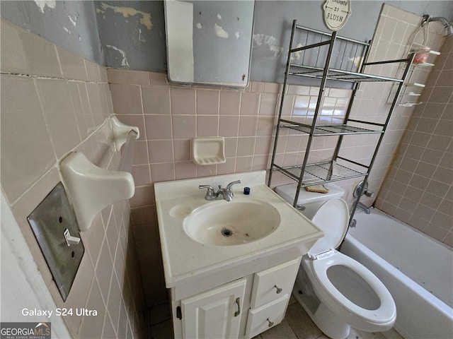 1243 Hill St NW, Conyers, GA 30012 - full bath featuring tile walls, vanity, toilet, and shower / tub combination