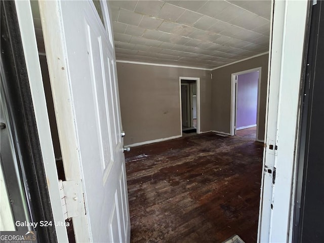 1243 Hill St NW, Conyers, GA 30012 - unfurnished room featuring ornamental molding, dark wood-style flooring, and baseboards