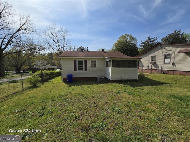 1243 Hill St NW, Conyers, GA 30012 - rear view of property featuring a sunroom, cooling unit, and central AC unit